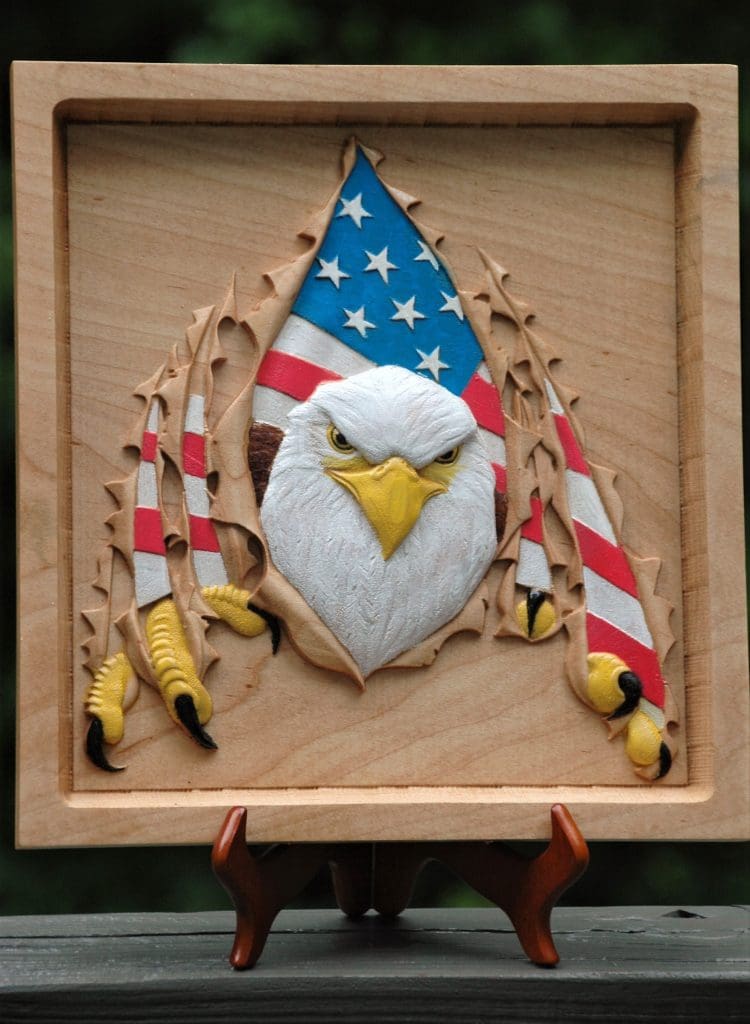 United States bald eagle tearing through plaque